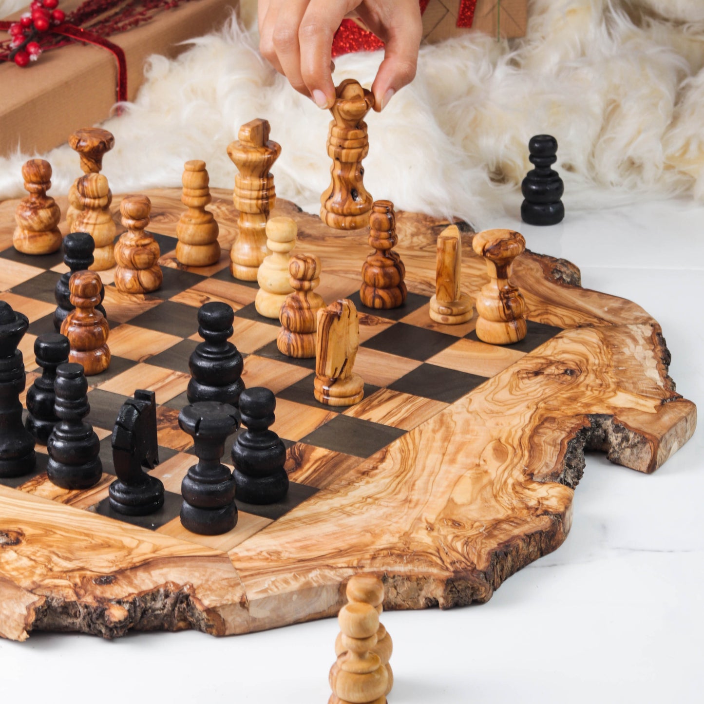 Handcrafted olive wood chess set with natural edges, artful pieces, and a rustic, organic board. Cozy background decor.