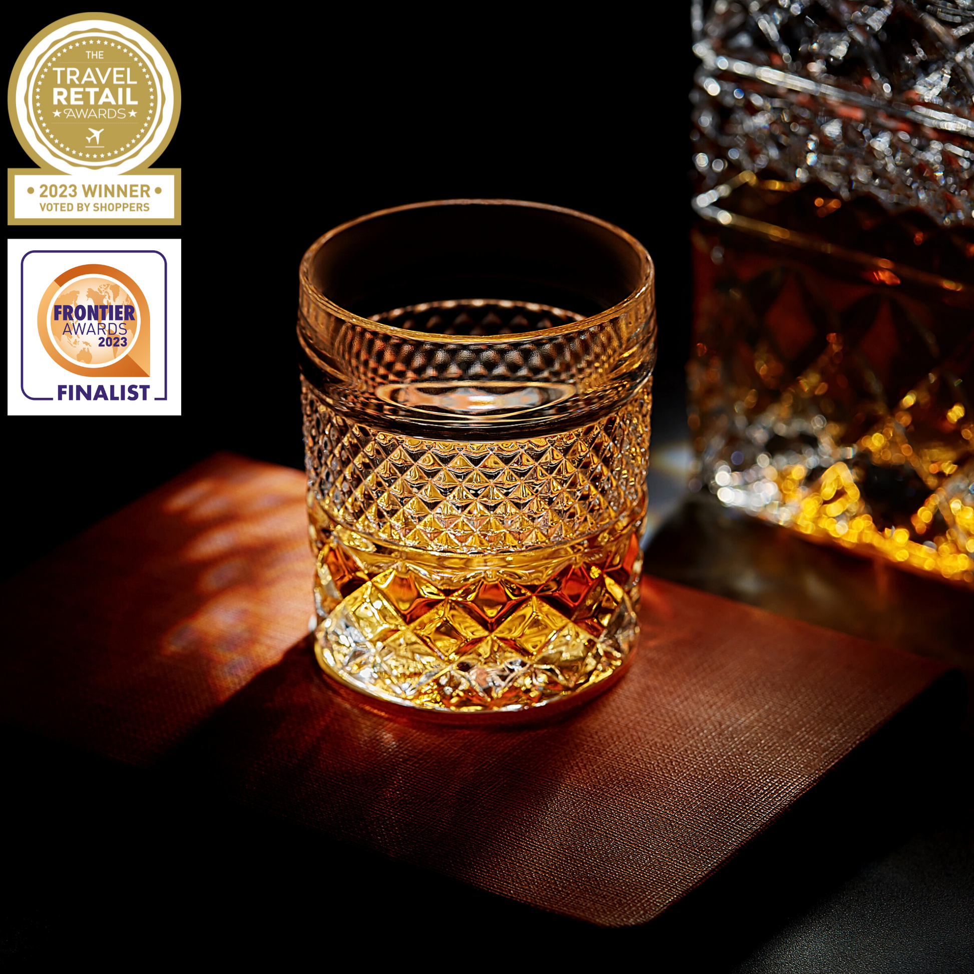 Crystal glass filled with whiskey, showcasing intricate patterns, with warm lighting highlighting its rich amber hue.